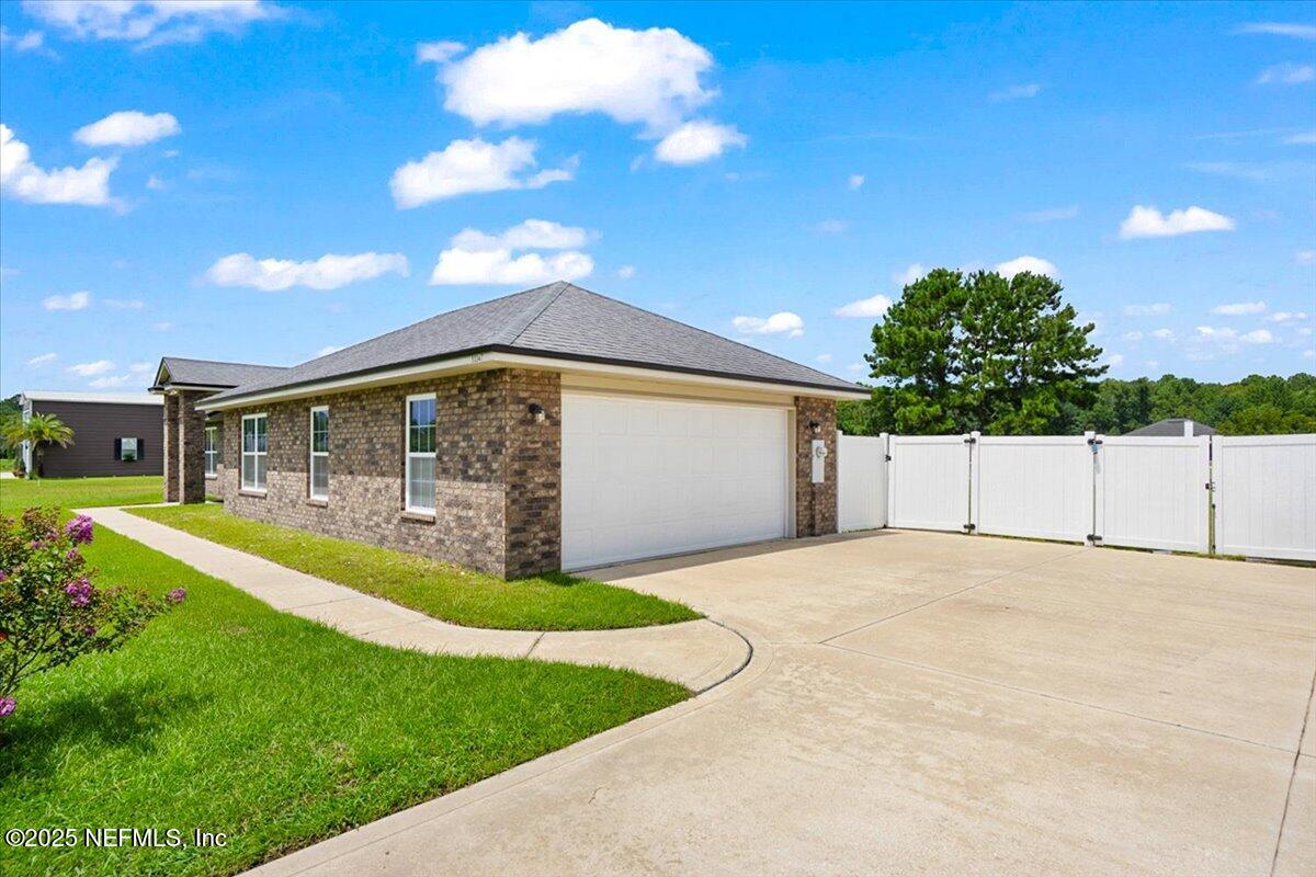 53347 Clear Lake Drive Callahan, FL 32011 - Photo 2 of 41 a view of an house with backyard space and balcony