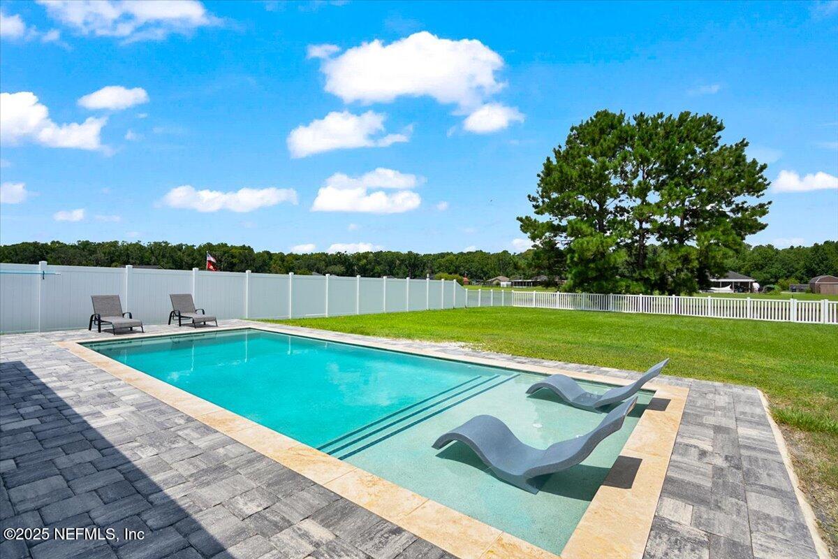 53347 Clear Lake Drive Callahan, FL 32011 - Photo 26 of 41 a view of a swimming pool and a yard