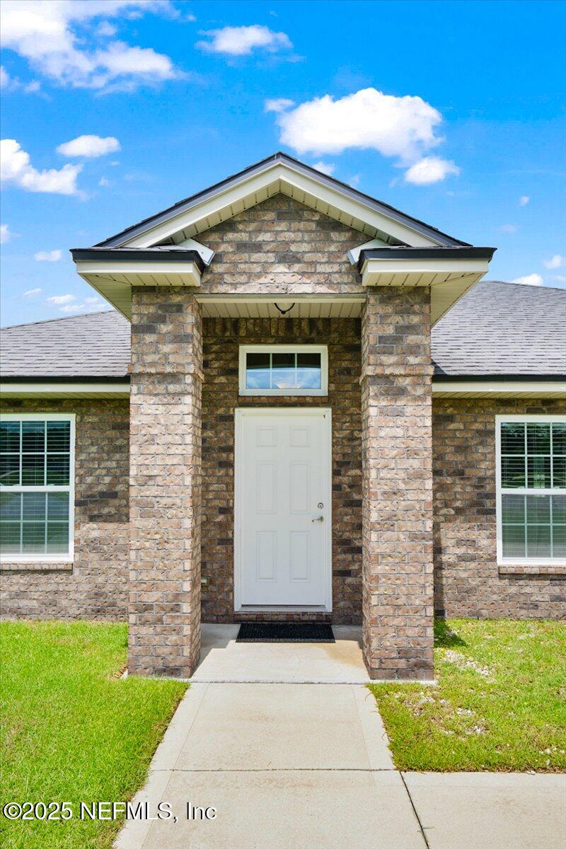 53347 Clear Lake Drive Callahan, FL 32011 - Photo 3 of 41 a front view of a house with a yard