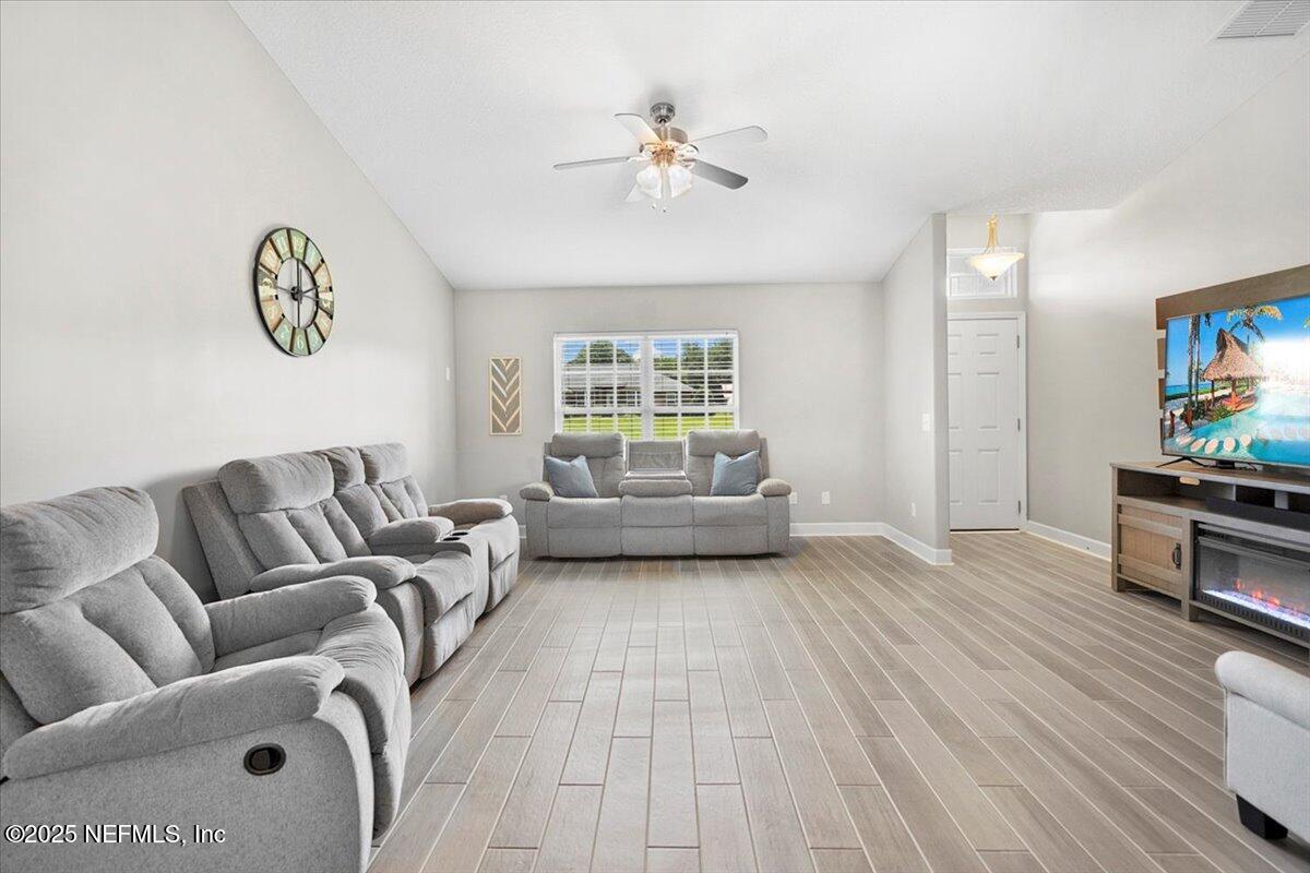 53347 Clear Lake Drive Callahan, FL 32011 - Photo 4 of 41 a living room with furniture and a window