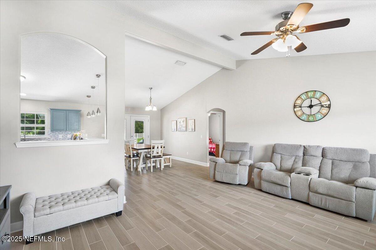 53347 Clear Lake Drive Callahan, FL 32011 - Photo 5 of 41 a living room with furniture and a wooden floor