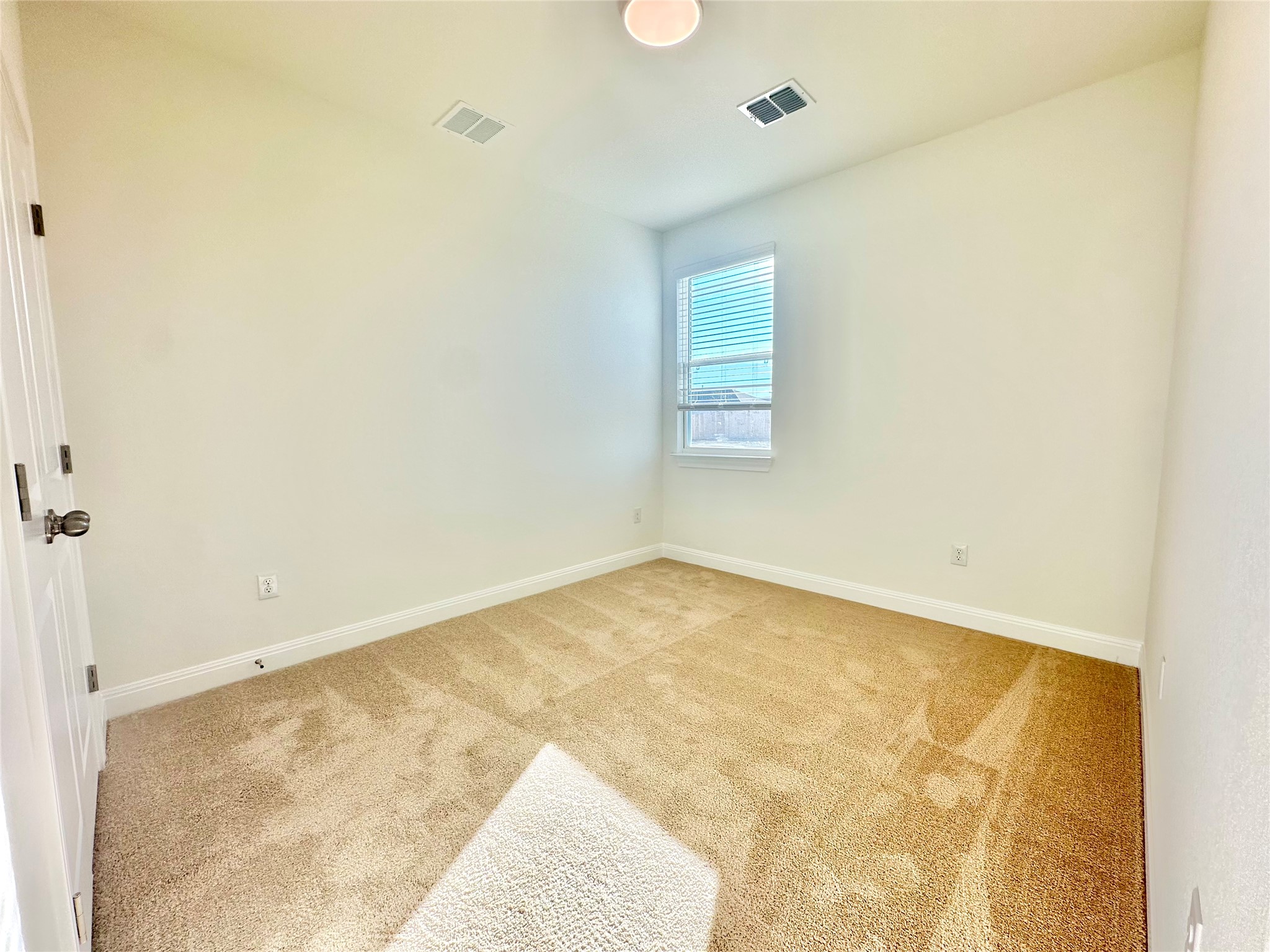 399 Porter Country Parkway Buda, TX 78610 - Photo 12 of 30 a view of empty room with wooden floor