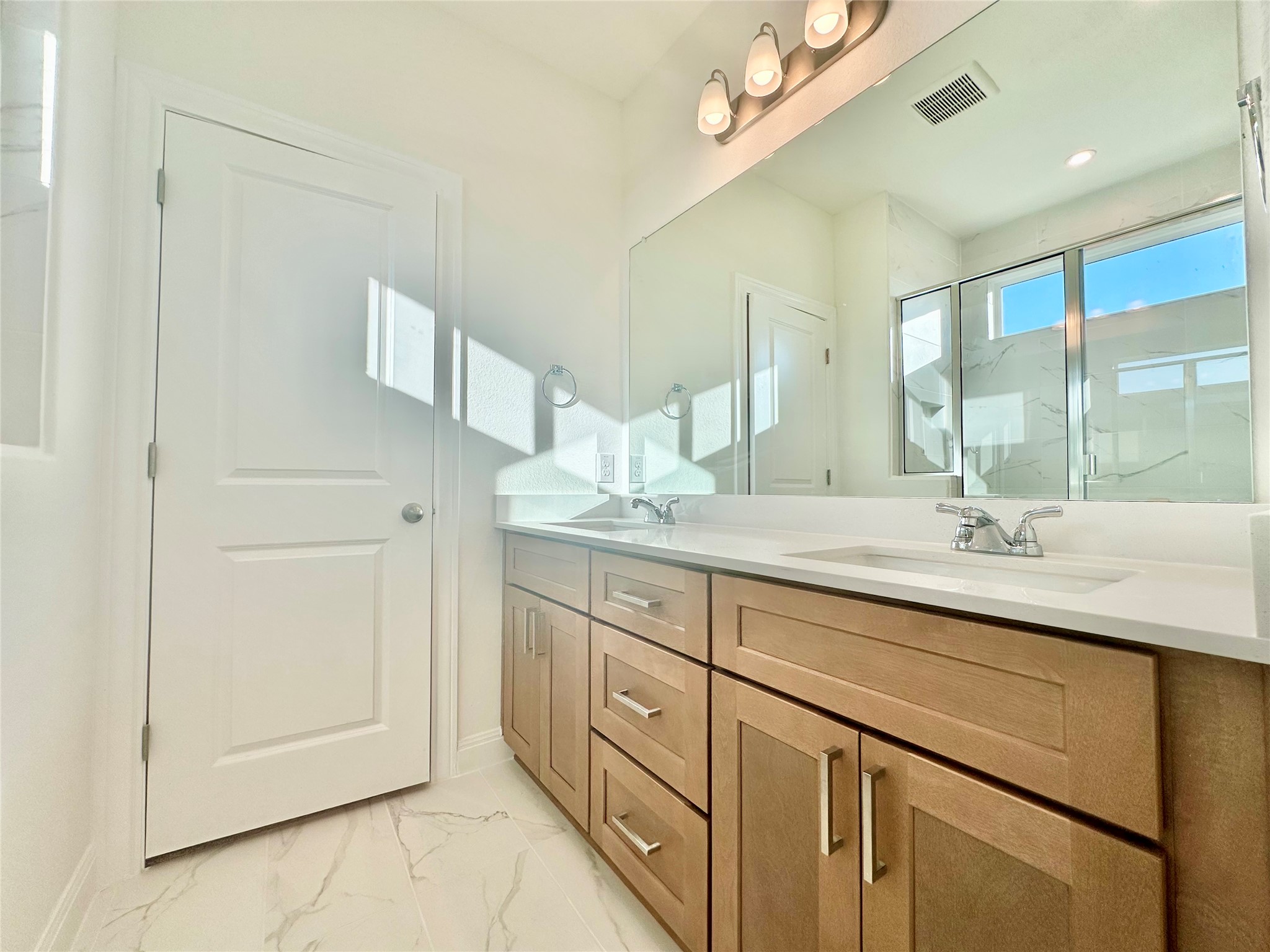 399 Porter Country Parkway Buda, TX 78610 - Photo 19 of 30 a bathroom with a granite countertop sink mirror and