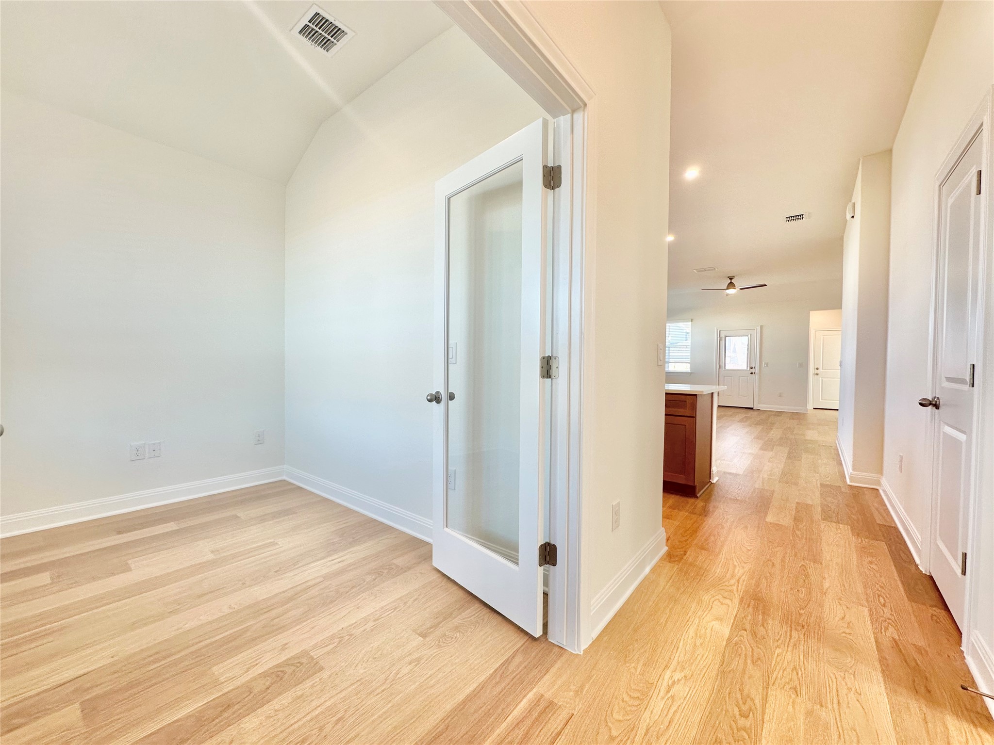 399 Porter Country Parkway Buda, TX 78610 - Photo 2 of 30 a view of a hallway with wooden floor
