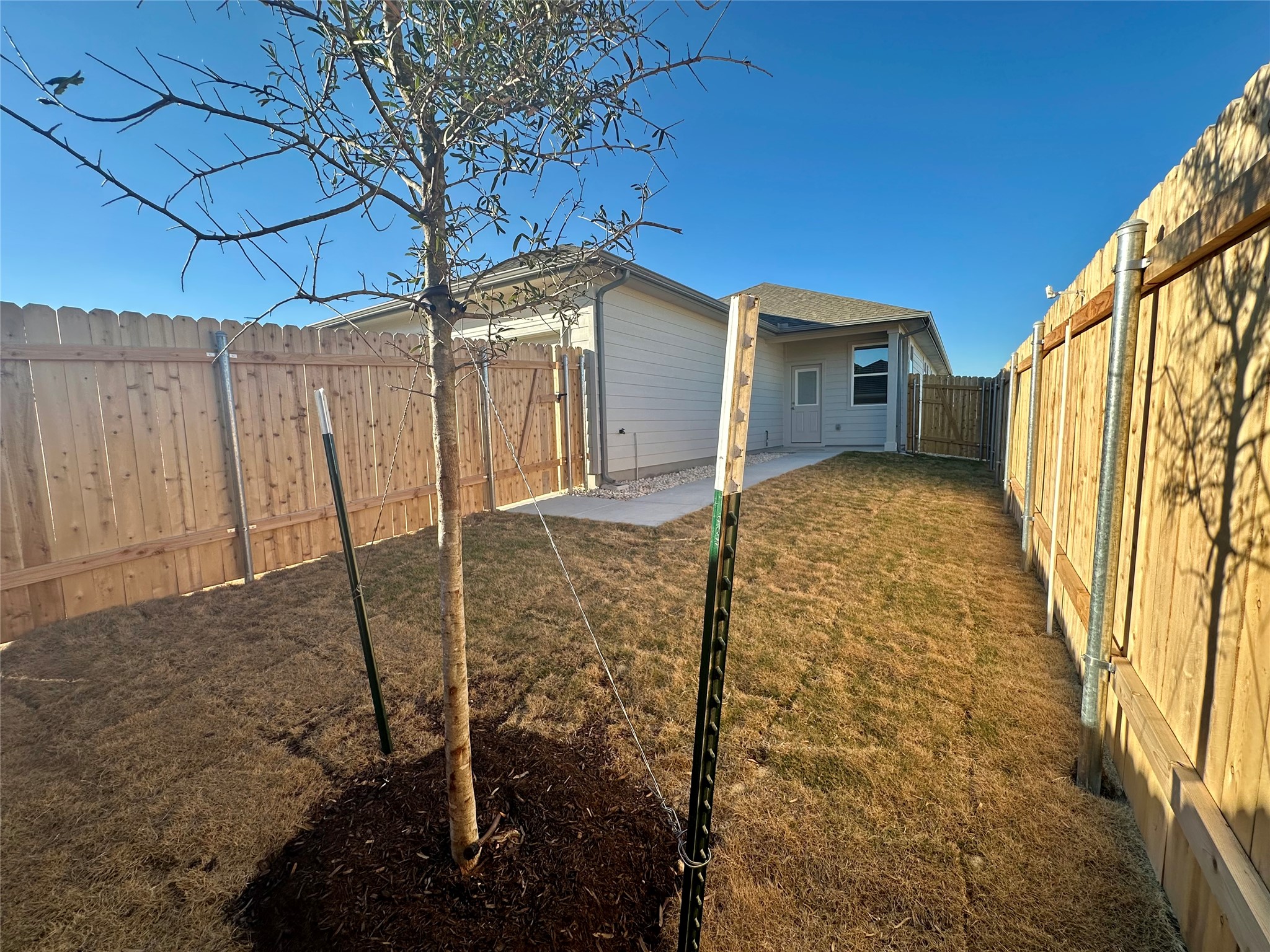 399 Porter Country Parkway Buda, TX 78610 - Photo 22 of 30 a house view with a backyard space