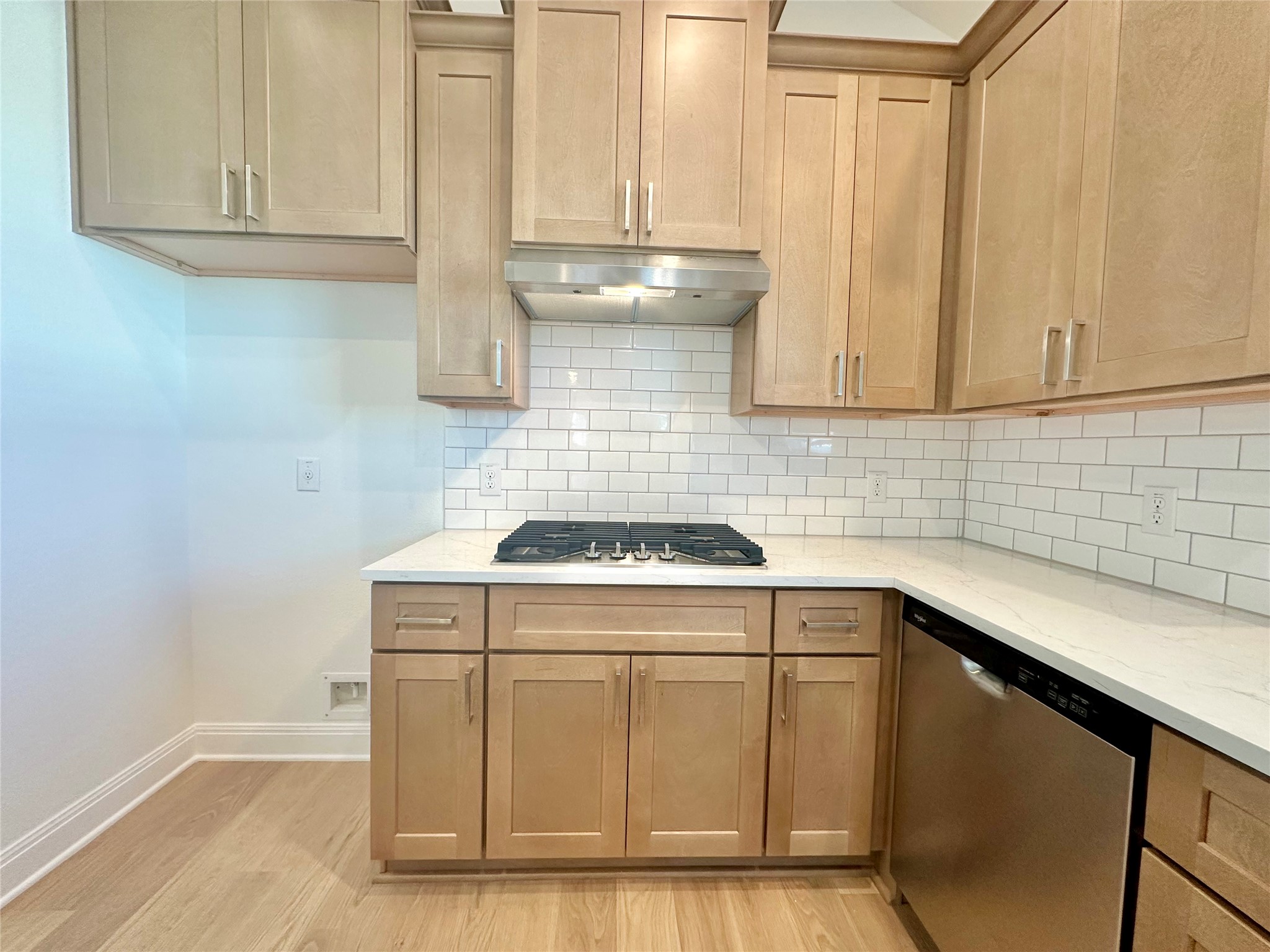399 Porter Country Parkway Buda, TX 78610 - Photo 8 of 30 a kitchen with a sink stove and cabinets