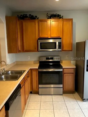 a kitchen with a stove microwave and refrigerator