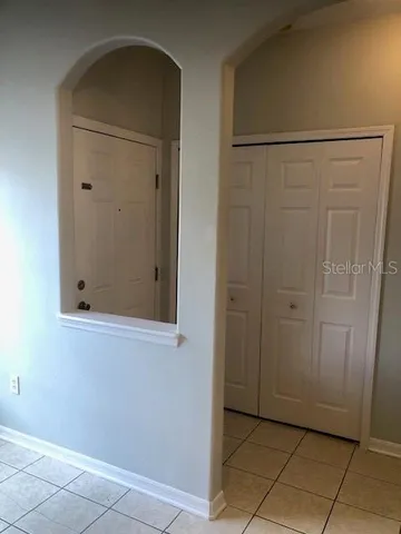 an empty room with wooden door