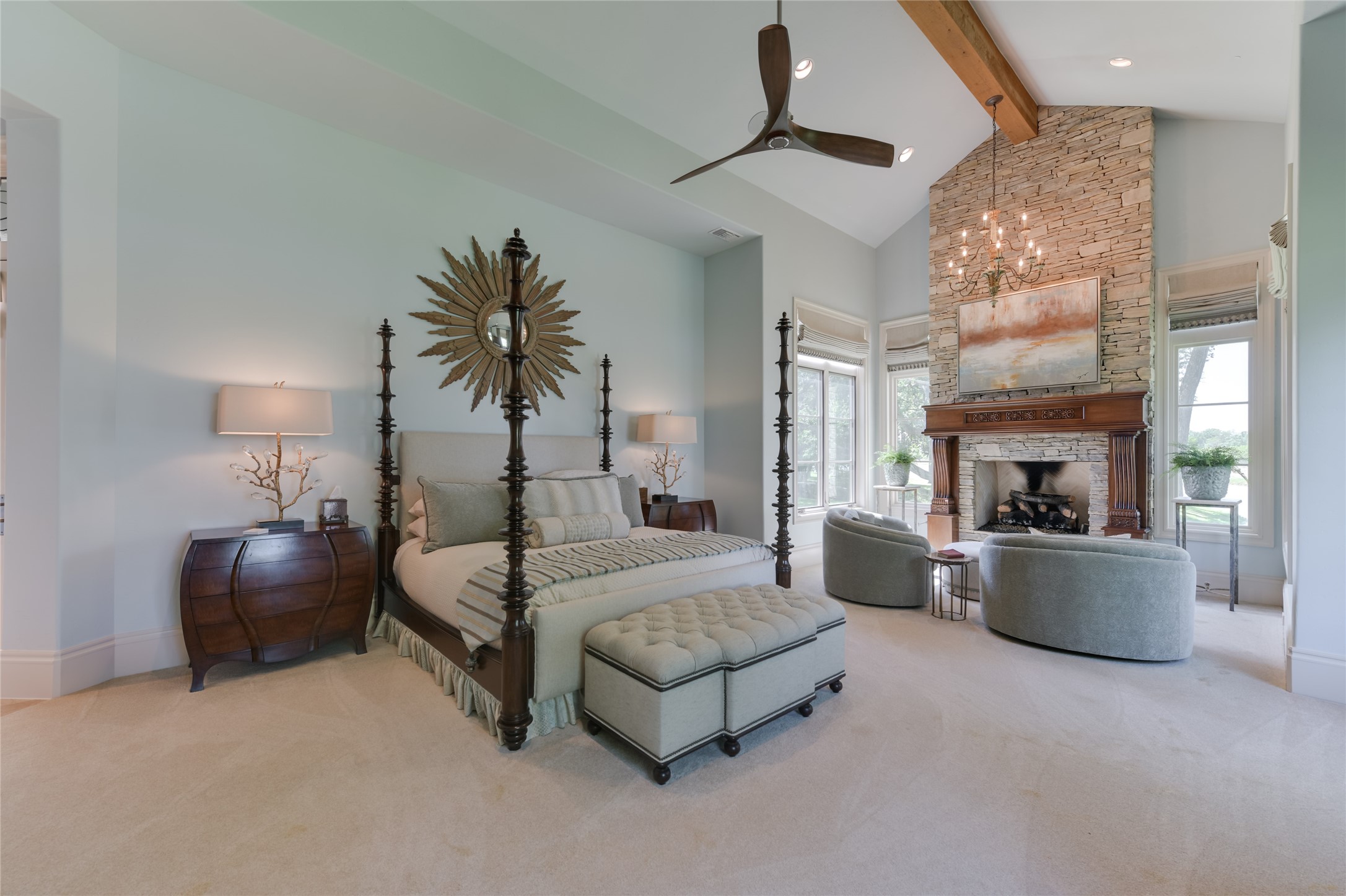 21729 Farm To Market 1887 Hempstead, TX 77445 - Photo 13 of 49 The elegant PRIMARY BEDROOM SUITE (22 X 18) is just off the formal Living Room and includes carpeted flooring, 16 foot pitched ceiling with exposed wood beam/recessed lighting/built-in speakers/ceiling fan, windows with auto-controlled drapery, softly painted walls and adjacent SITTING AREA (12 X 8) with its carpeted flooring, glass/metal hanging chandelier, gas log fireplace with slate stone surround/decorative carved wood mantel.