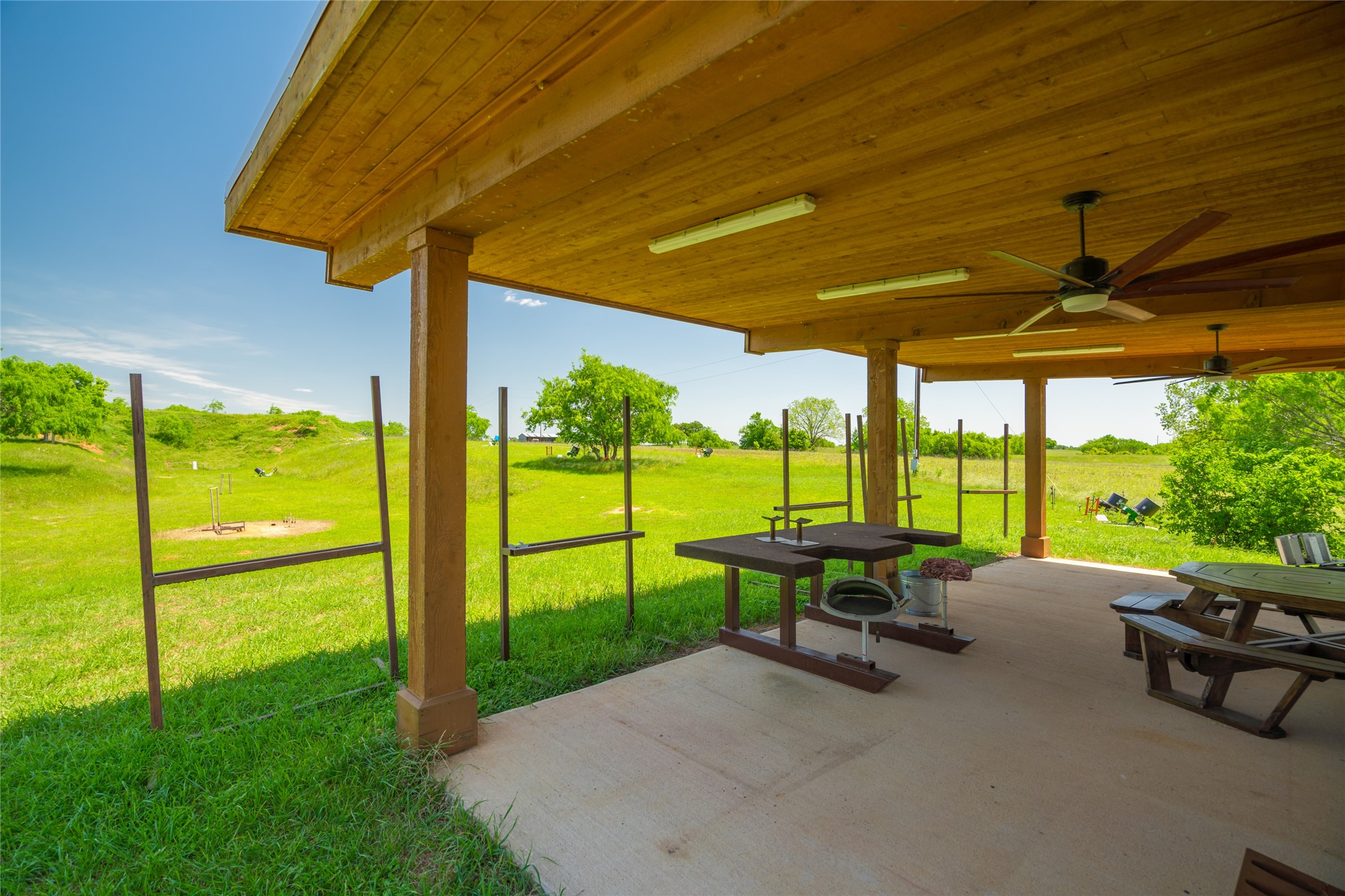 21729 Farm To Market 1887 Hempstead, TX 77445 - Photo 39 of 49 RIFLE RANGE with covered facility and hillside targets beyond.