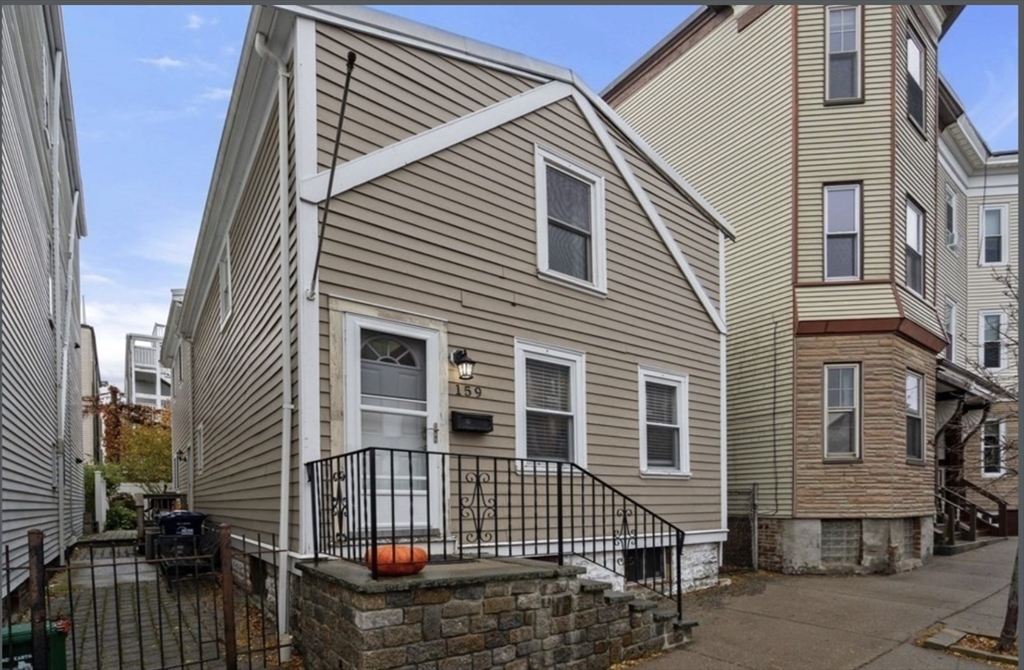 159 N Street Boston, MA 02127 - Photo 12 of 13 a front view of a house with garage