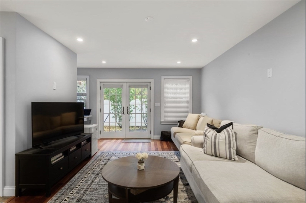 159 N Street Boston, MA 02127 - Photo 2 of 13 a living room with furniture and a flat screen tv