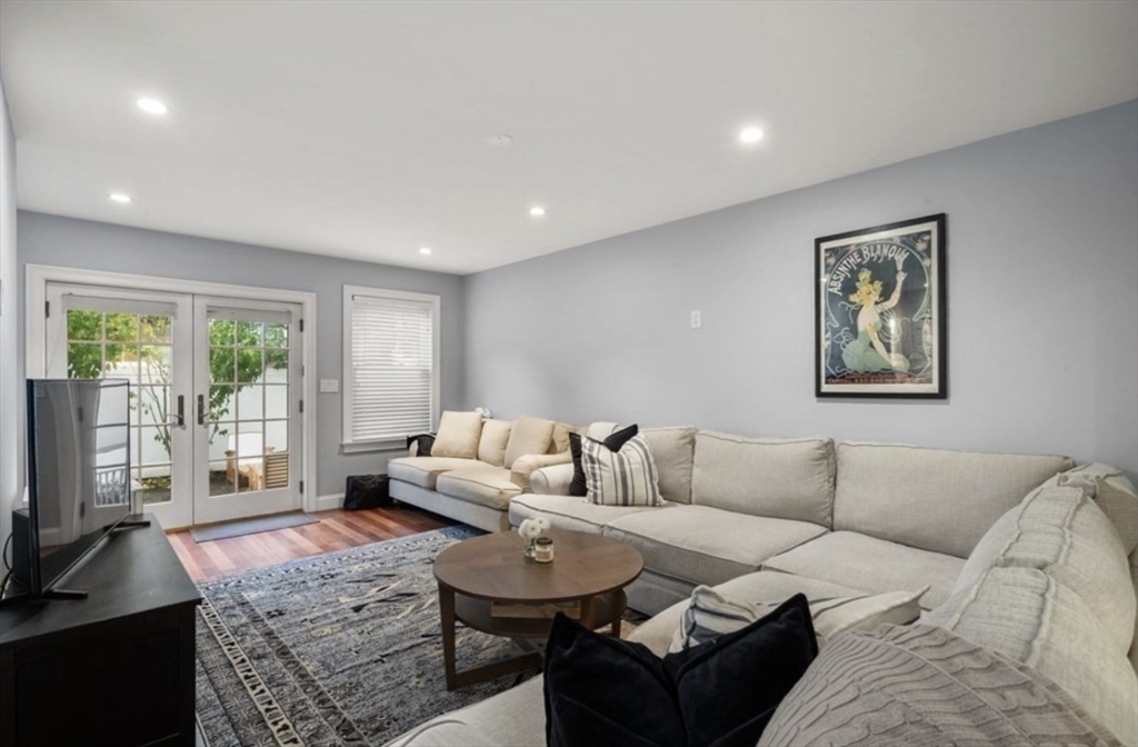 159 N Street Boston, MA 02127 - Photo 5 of 13 a living room with furniture and a flat screen tv