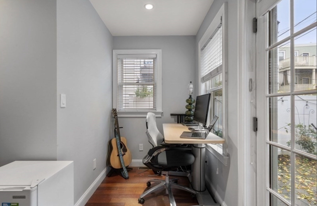 159 N Street Boston, MA 02127 - Photo 7 of 13 a view of a workspace with furniture and a window