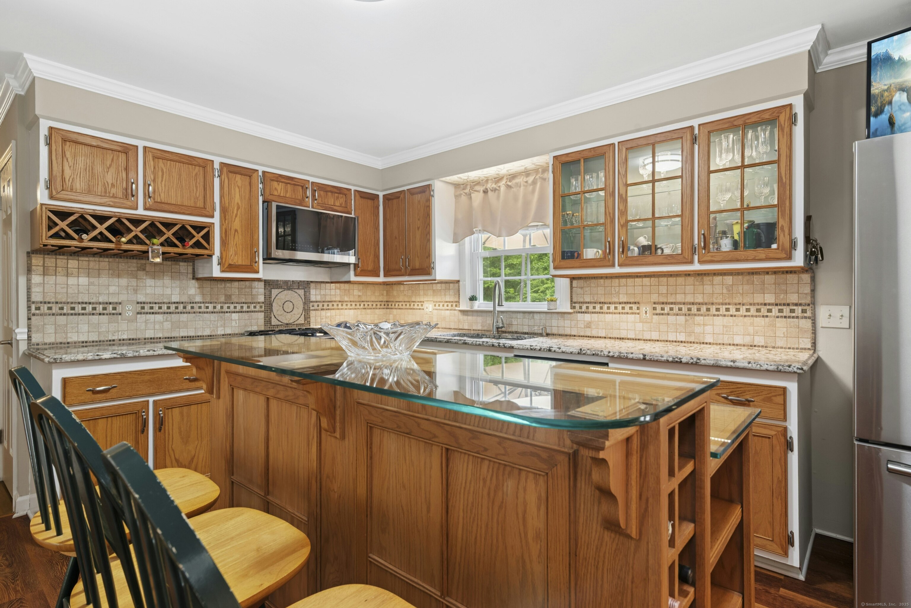 40 Winthrop Place Monroe, CT 06468 - Photo 17 of 38 a kitchen with stainless steel appliances granite countertop a sink stove and cabinets