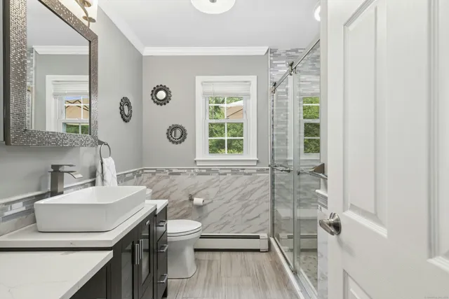 a living room with a couch and a large window