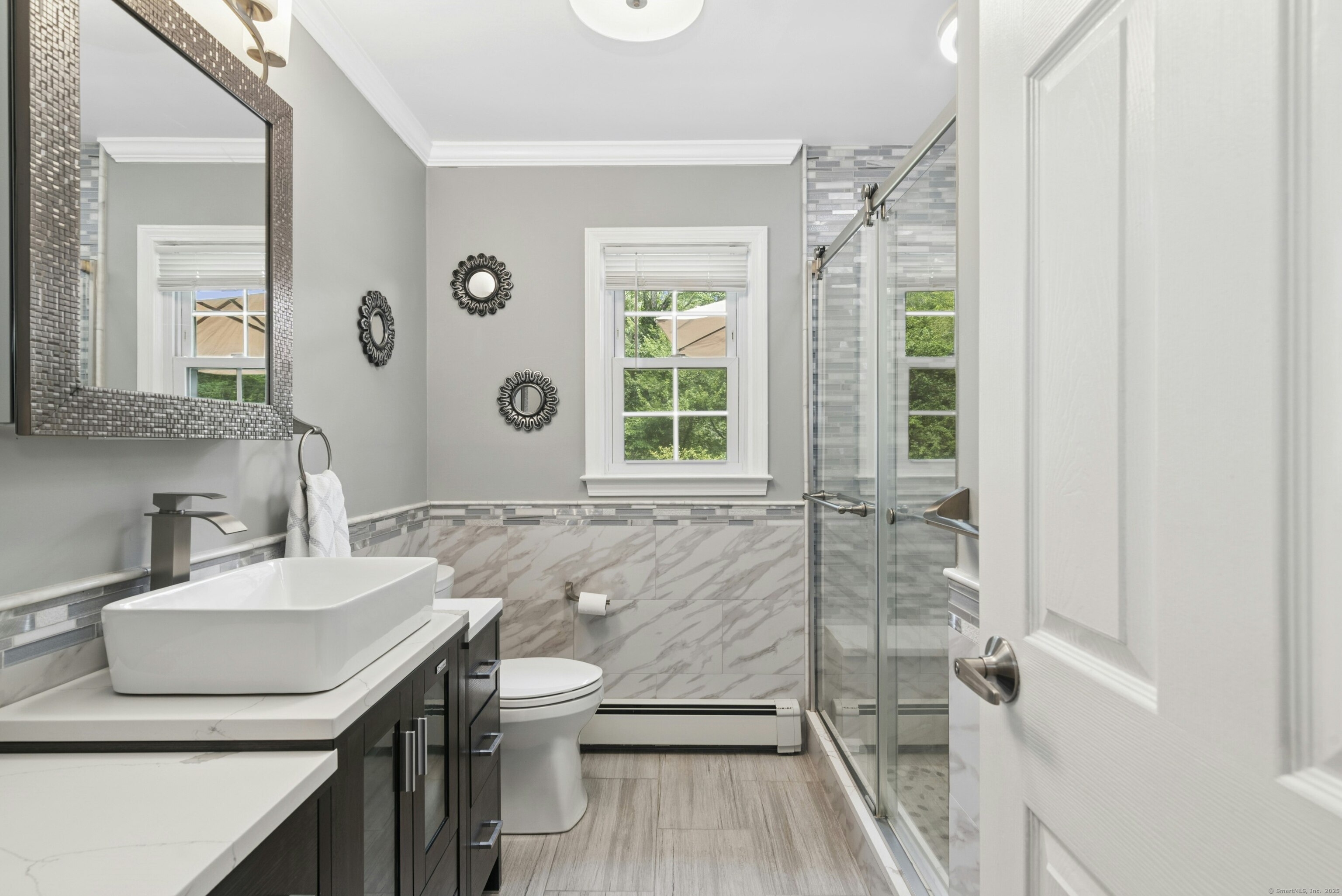 40 Winthrop Place Monroe, CT 06468 - Photo 23 of 38 a bathroom with a sink a toilet a mirror and shower