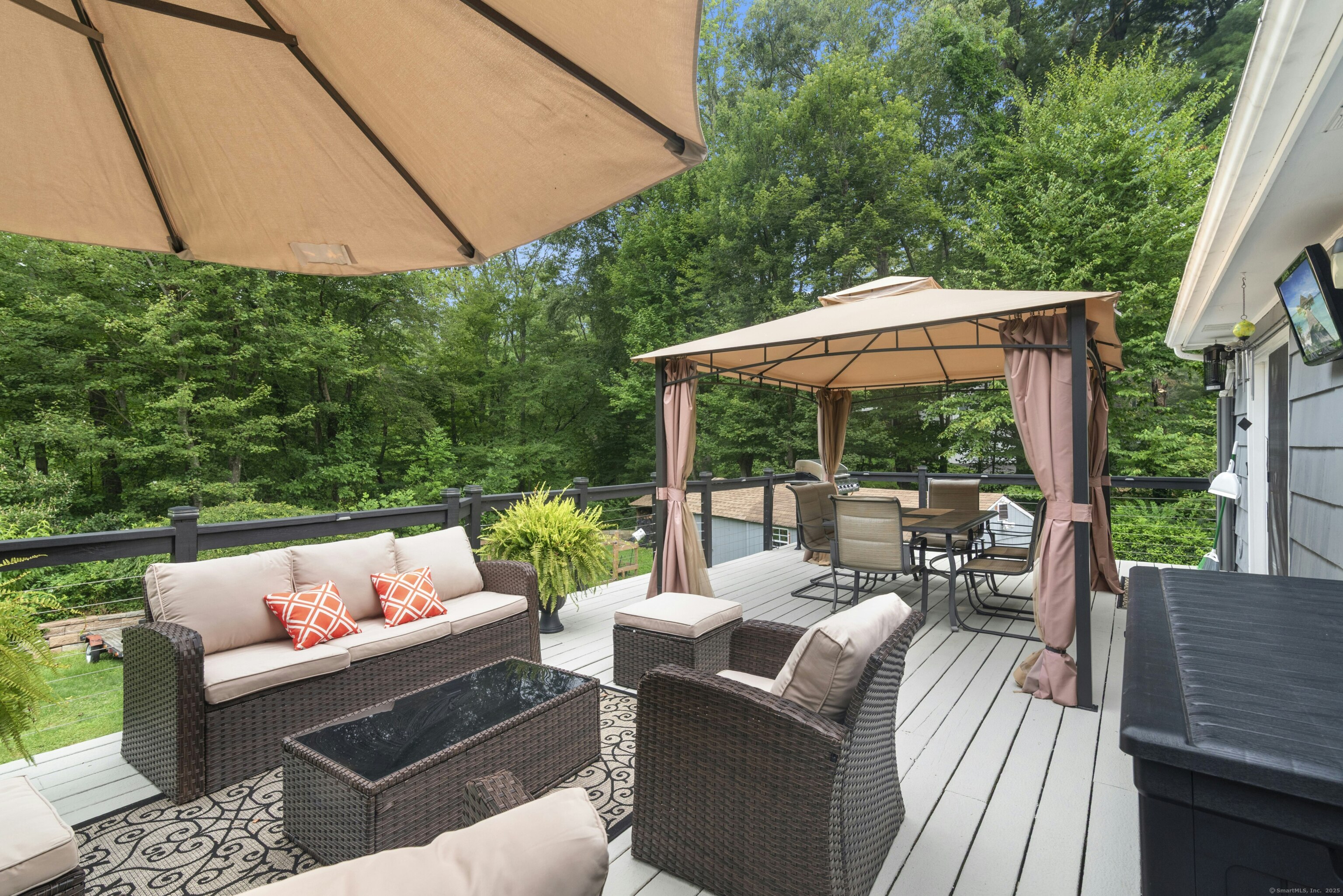 40 Winthrop Place Monroe, CT 06468 - Photo 29 of 38 a view of patio with couches table and chairs under an umbrella