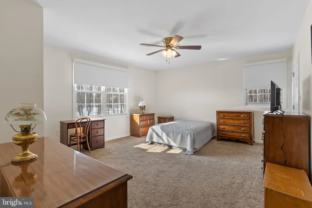 a bathroom with a granite countertop toilet a sink and bathtub