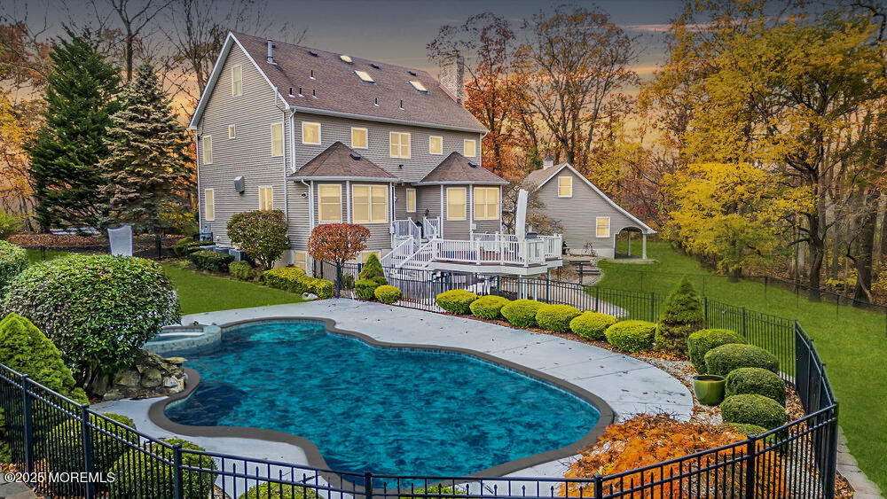 a view of a house with a backyard porch and sitting area
