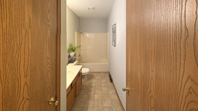 a view of a bathroom from the hallway