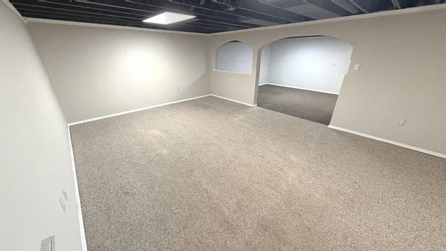 a bed room with a bed furniture and a wooden floor