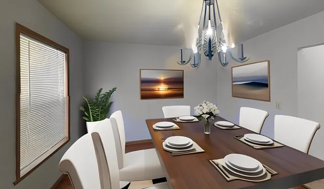 a bedroom with bed and a potted plant