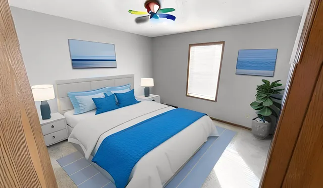 a spacious bedroom with a bed and a cabinets