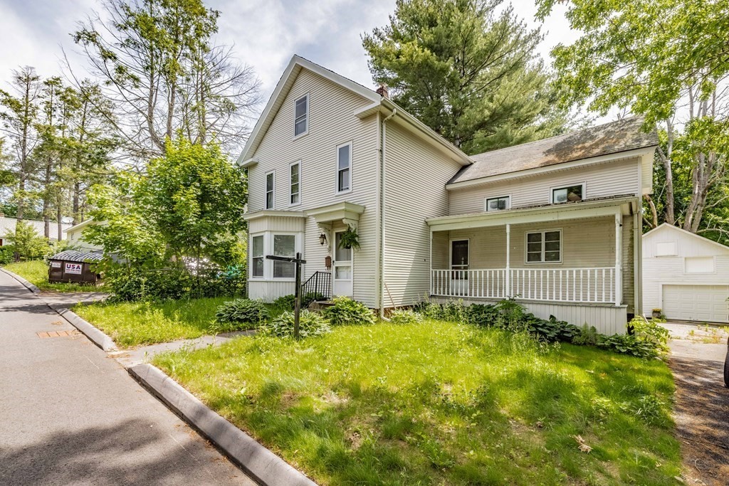 17 Spring Street Ware, MA 01082 - Photo 1 of 28 a view of a white house with a large pool table and chairs