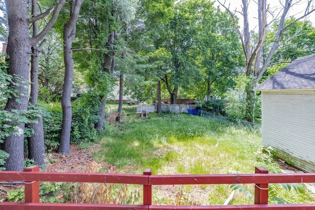 17 Spring Street Ware, MA 01082 - Photo 11 of 28 a view of backyard with a garden and trees