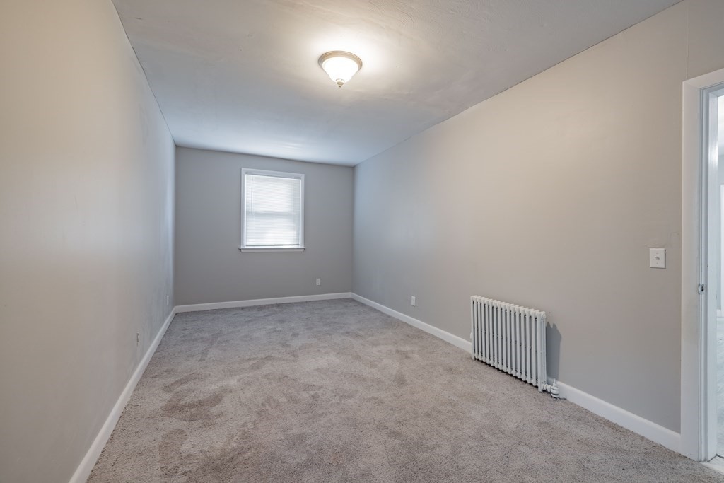 17 Spring Street Ware, MA 01082 - Photo 15 of 28 an empty room with a window