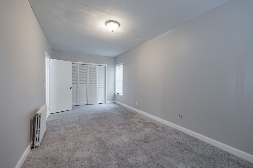 17 Spring Street Ware, MA 01082 - Photo 17 of 28 a view of an empty room and a window