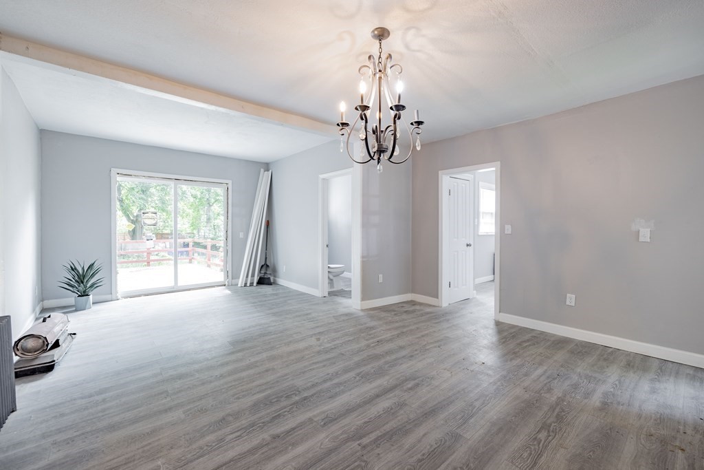 17 Spring Street Ware, MA 01082 - Photo 18 of 28 a view of a livingroom with a furniture wooden floor and chandelier