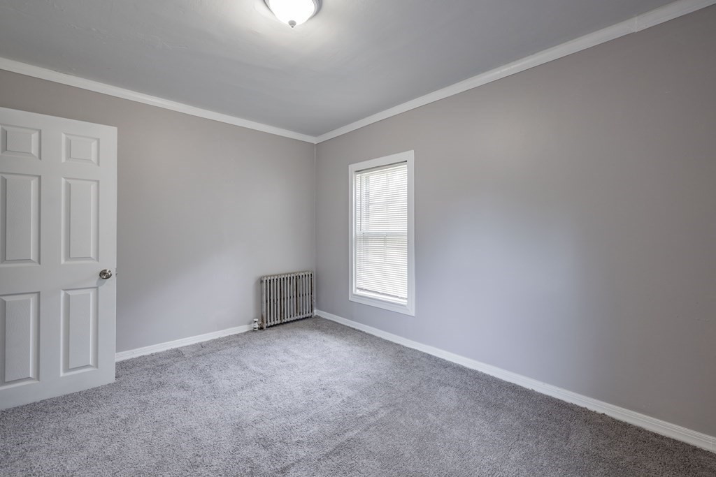 17 Spring Street Ware, MA 01082 - Photo 4 of 28 an empty room with windows