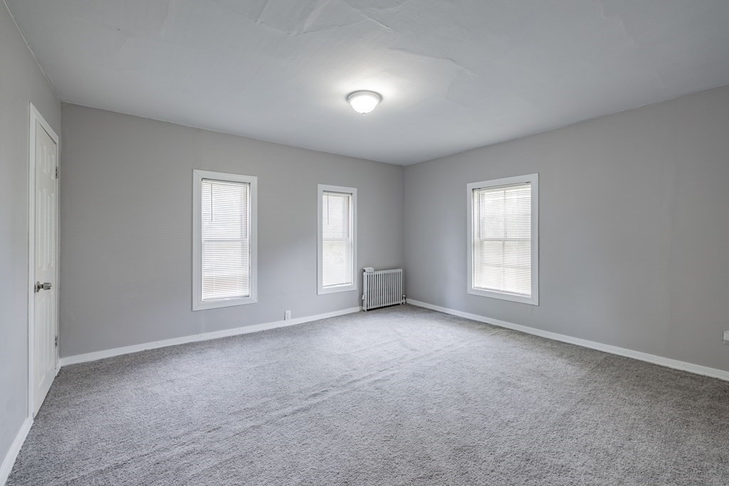 17 Spring Street Ware, MA 01082 - Photo 5 of 28 an empty room with windows
