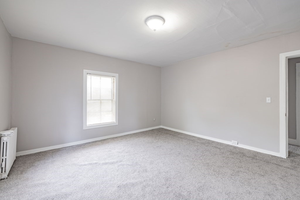 17 Spring Street Ware, MA 01082 - Photo 7 of 28 an empty room with a window