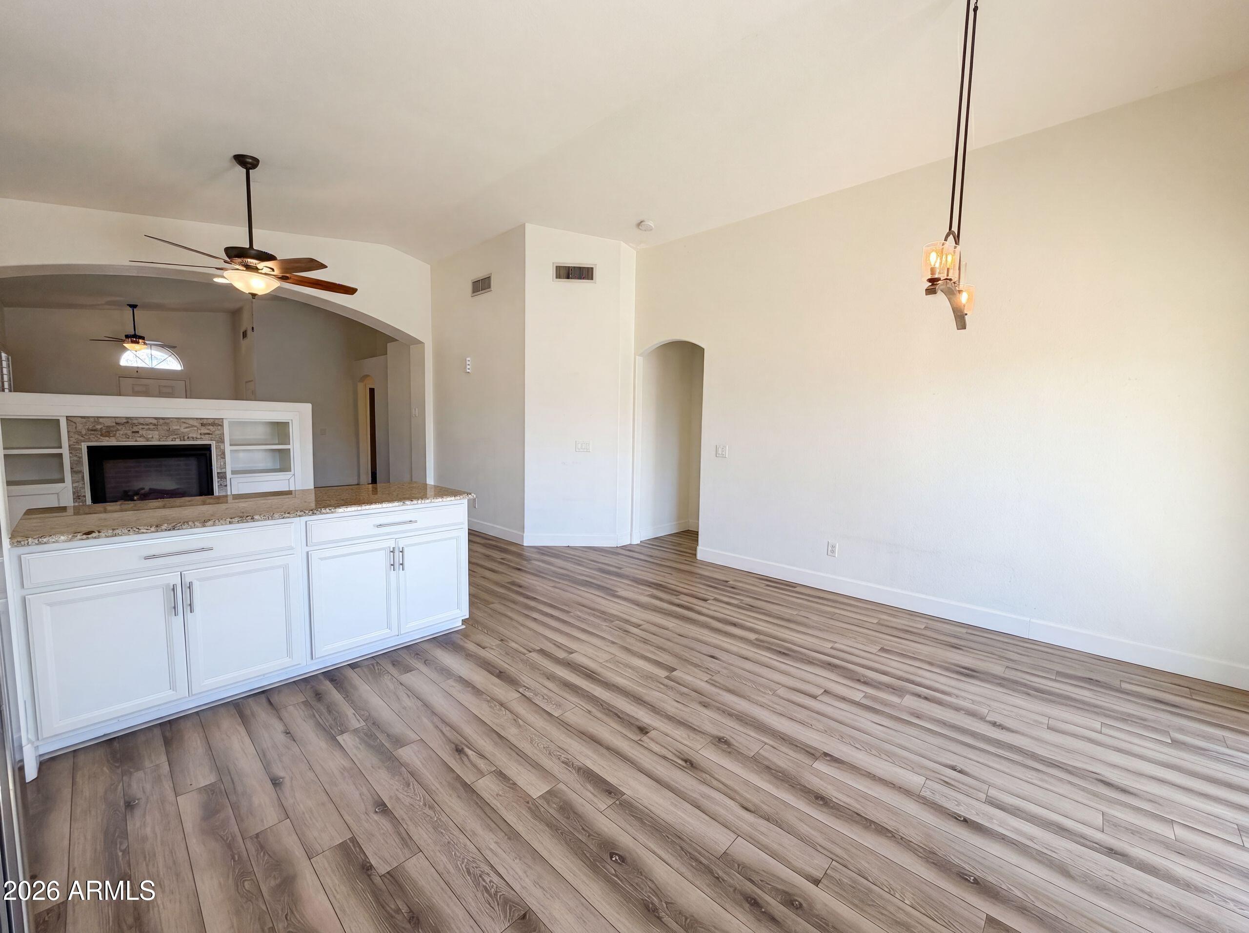 3951 East Timberline Road Gilbert, AZ 85297 - Photo 12 of 28 a view of a kitchen with microwave and cabinets