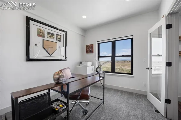 a work room with furniture and windows