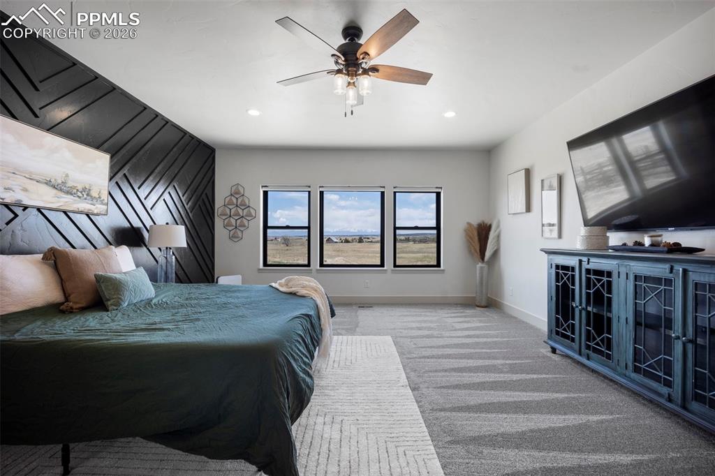 16535 Sweet Road Peyton, CO 80831 - Photo 20 of 45 a living room with furniture fireplace and flat screen tv