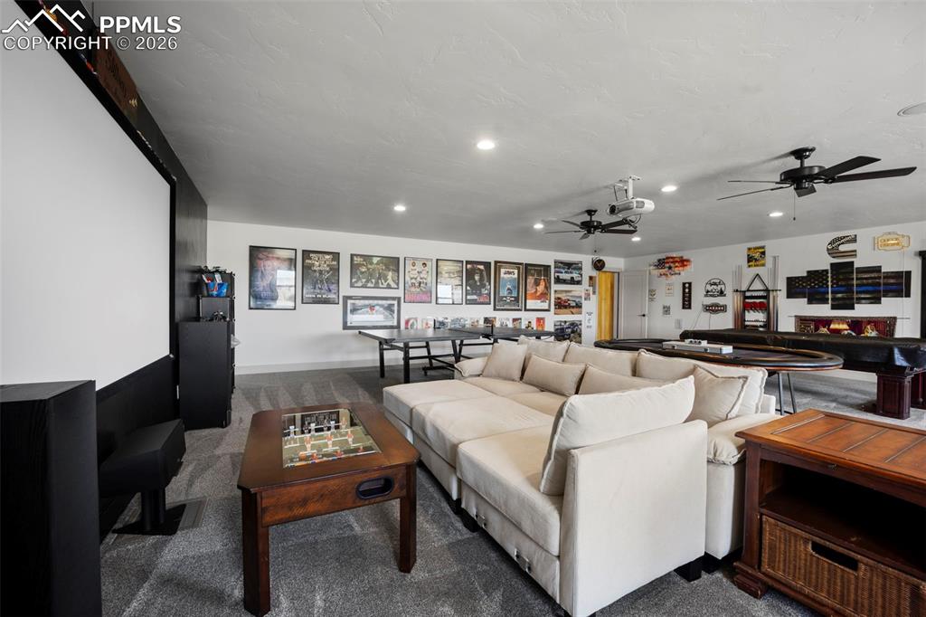 16535 Sweet Road Peyton, CO 80831 - Photo 32 of 45 a living room with furniture and a table