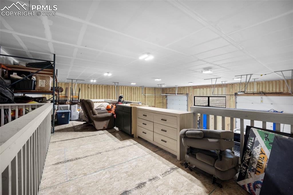 16535 Sweet Road Peyton, CO 80831 - Photo 39 of 45 a kitchen with a stove a refrigerator and a cabinets