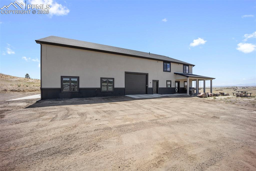 16535 Sweet Road Peyton, CO 80831 - Photo 41 of 45 a view of a house with a snow on the road