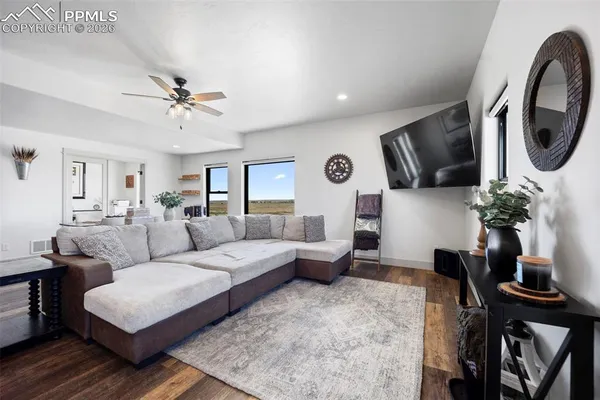 a living room with furniture and a flat screen tv