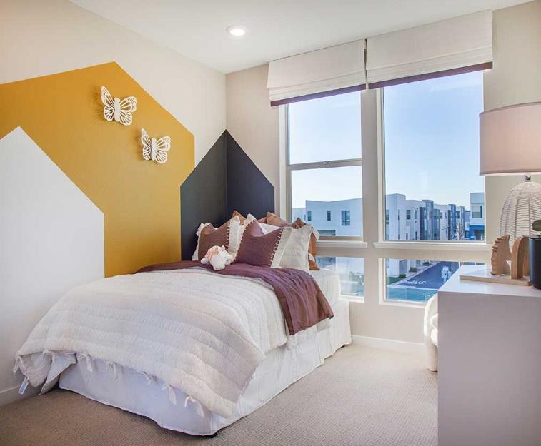 6617 Optimun Loop San Jose, CA 95119 - Photo 8 of 8 a bedroom with a bed and a large window