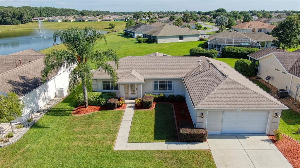 8637 Southeast 137th Loop Summerfield, FL 34491 - Photo 1 of 1 an aerial view of a house with swimming pool and garden
