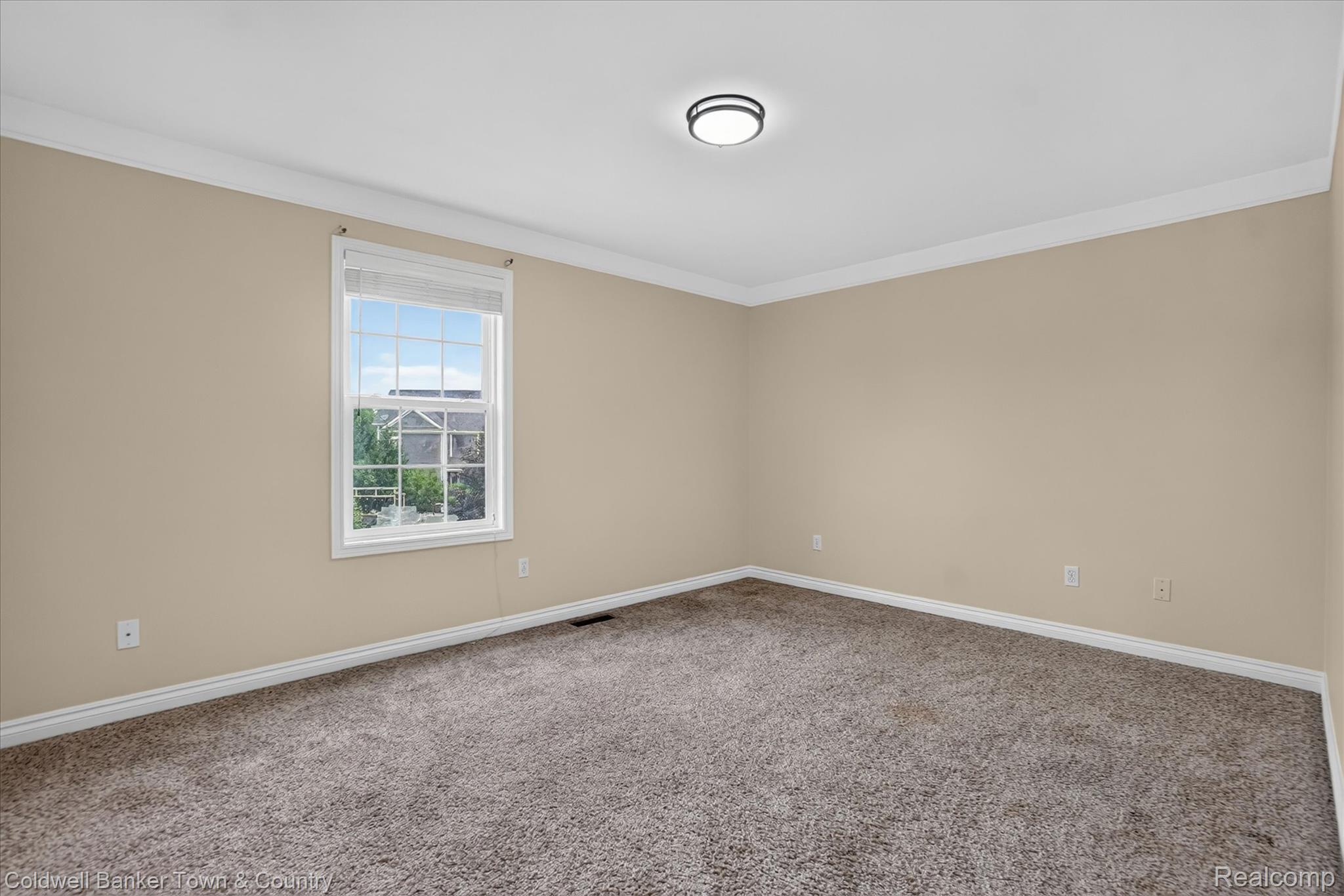 1725 Town Commons Drive Howell, MI 48855 - Photo 38 of 53 Neutral-toned walls complement plush carpeting