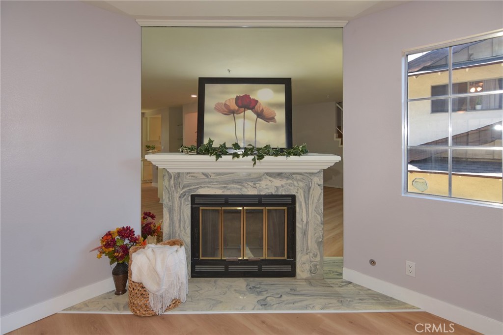 1712 Pepper Street, Unit A Alhambra, CA 91801 - Photo 15 of 39 a living room with a fireplace and a potted plant