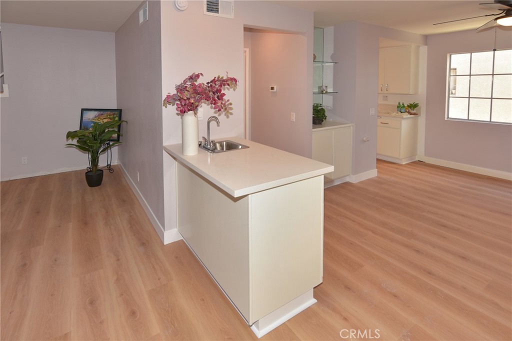 1712 Pepper Street, Unit A Alhambra, CA 91801 - Photo 16 of 39 a hallway with a stove top oven and wooden floor