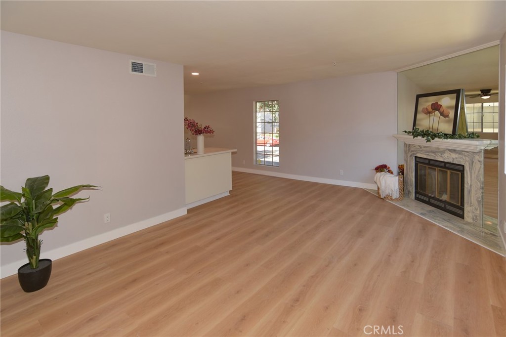 1712 Pepper Street, Unit A Alhambra, CA 91801 - Photo 2 of 39 a view of empty room with wooden floor and a window