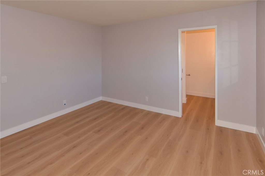 1712 Pepper Street, Unit A Alhambra, CA 91801 - Photo 21 of 39 a view of an empty room with wooden floor and a window